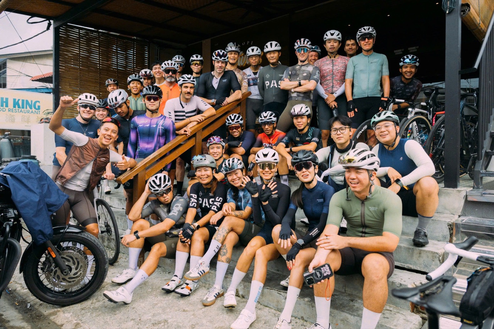 A large cycling community gathered for a group portrait