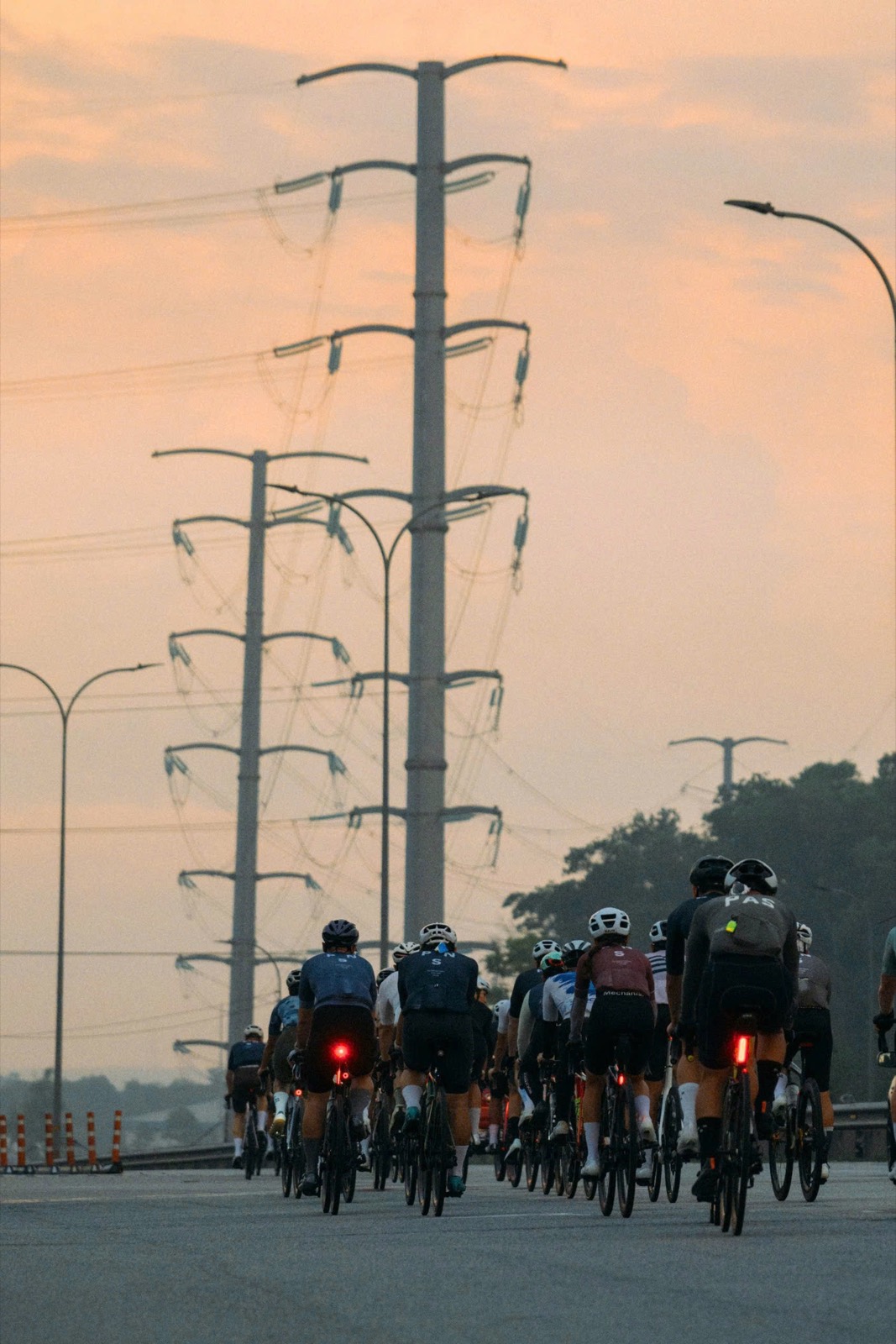 A peloton riding together in the early morning
