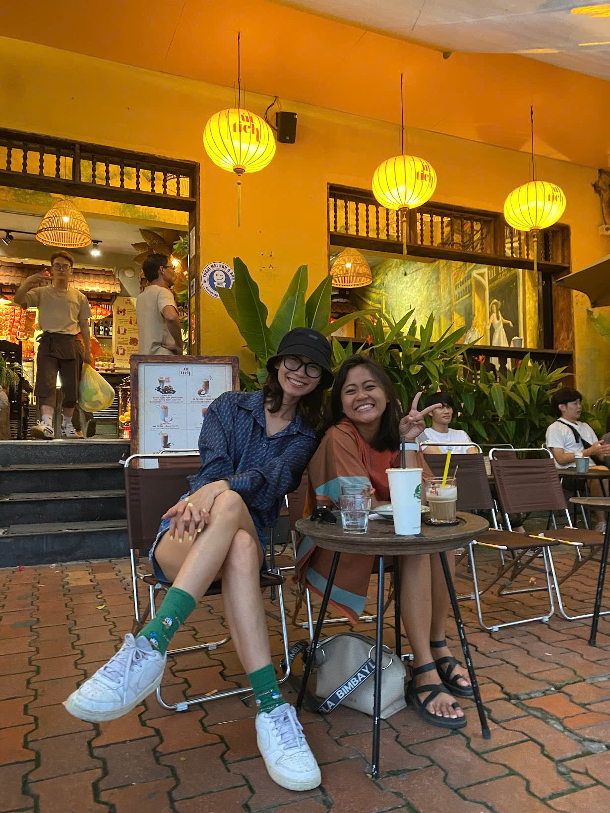 Two friends enjoying a café in Vietnam