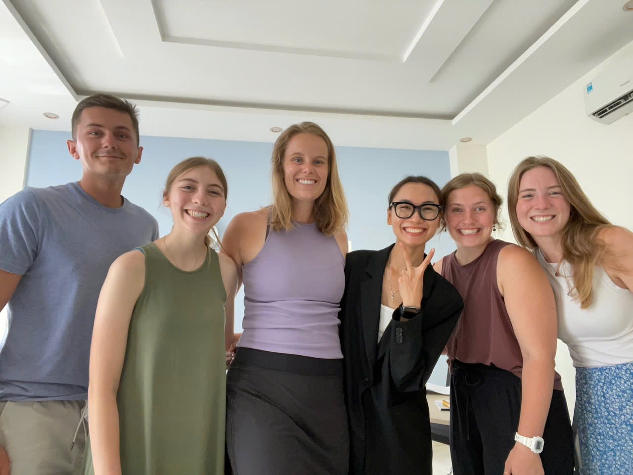 Diem smiling with an international class