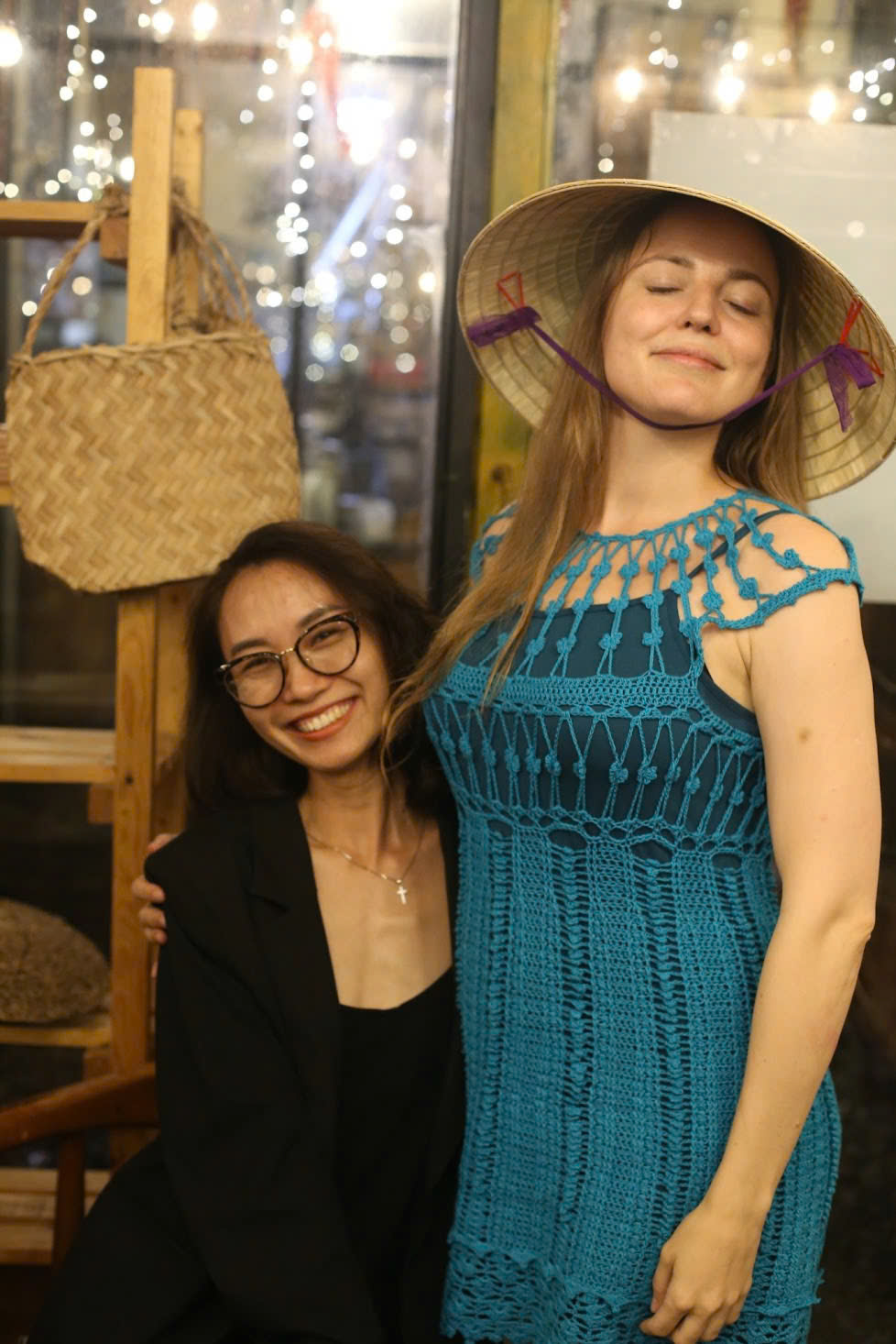 Diem and a learner sharing a playful cultural moment